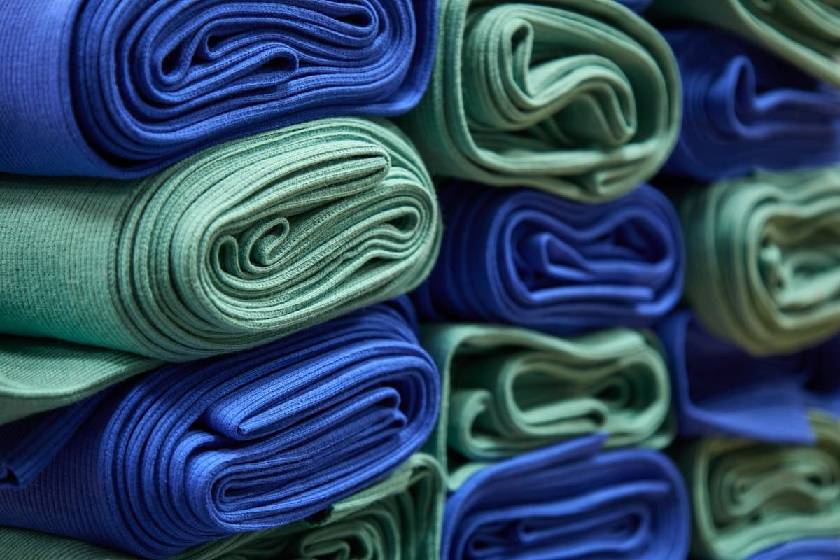 Folded fabric stacked by colour