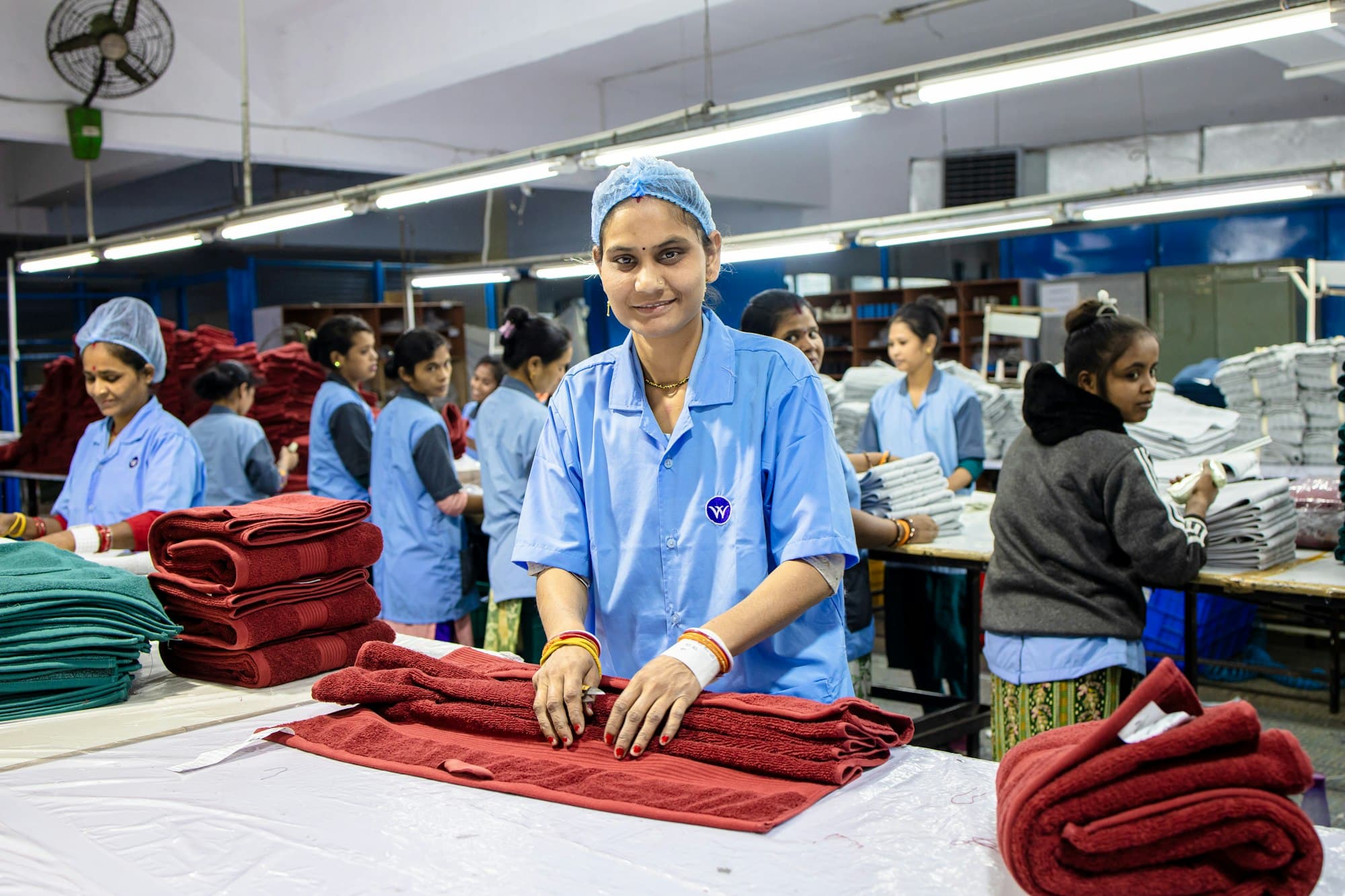 Workers folding finished garments