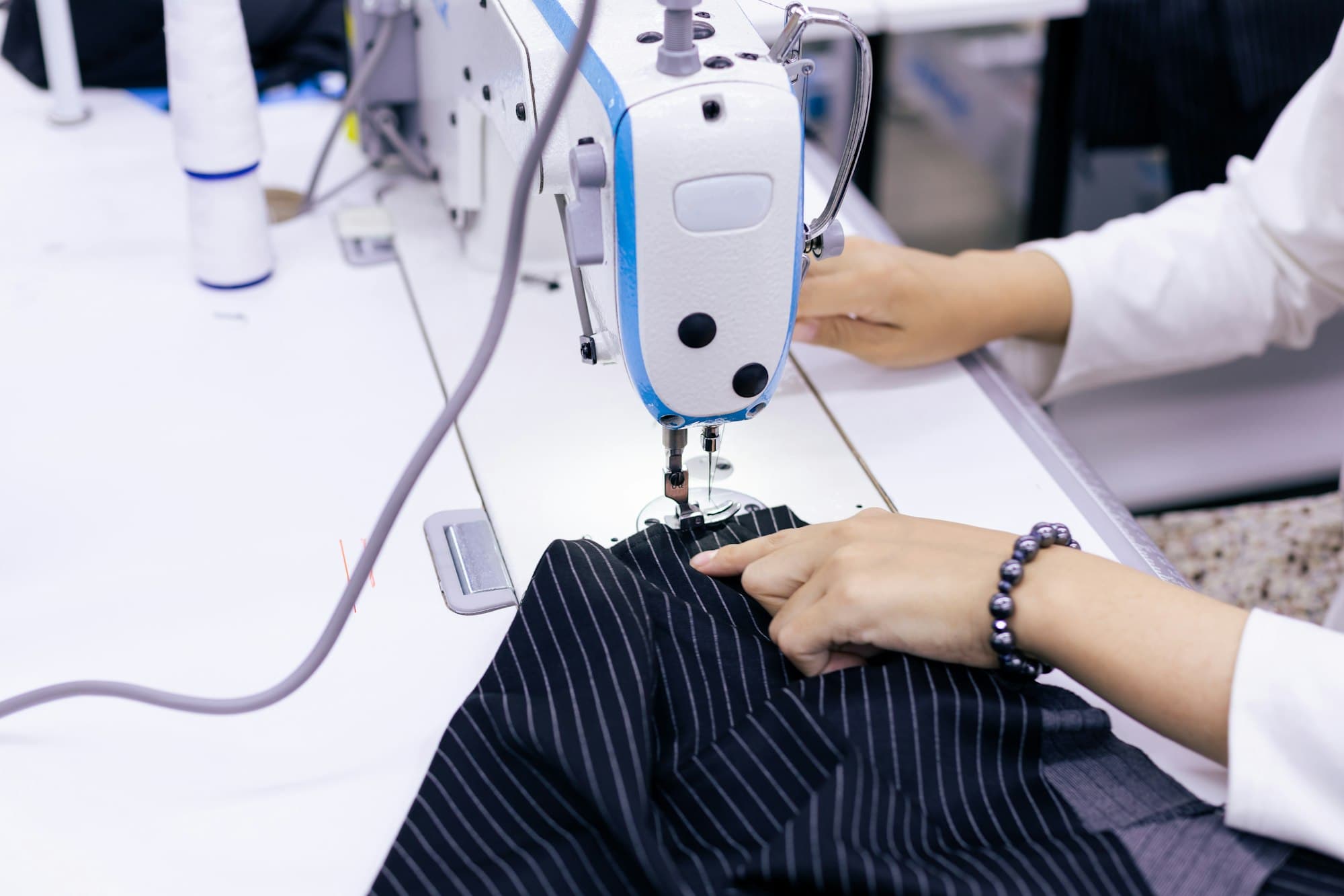 A machinist stitching a garment